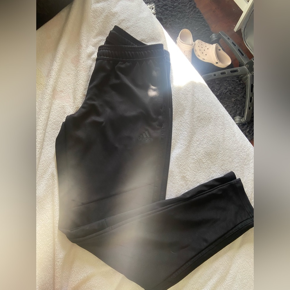 All black adidas track pants